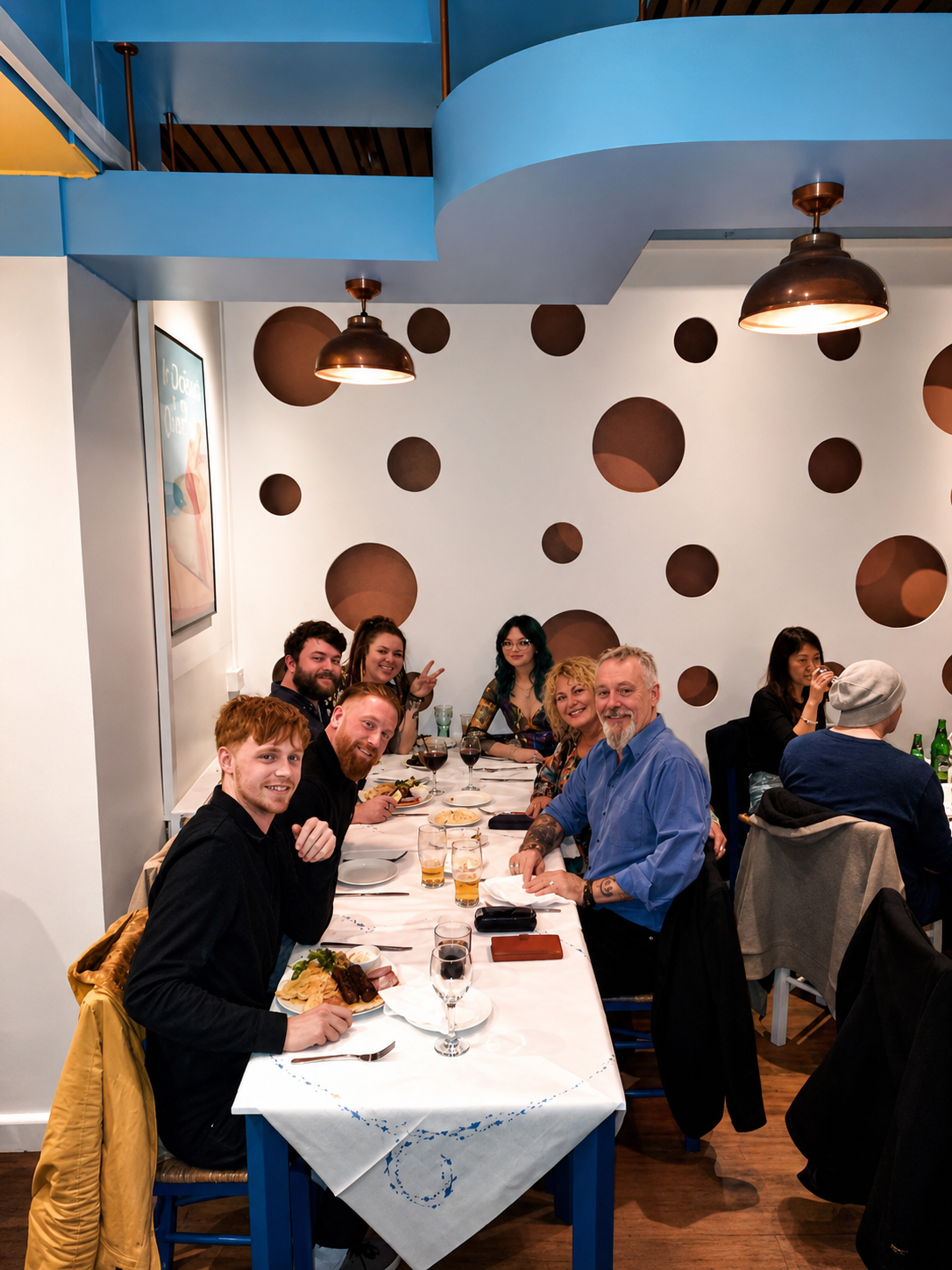 Friends dining together beneath Island's blue ceiling