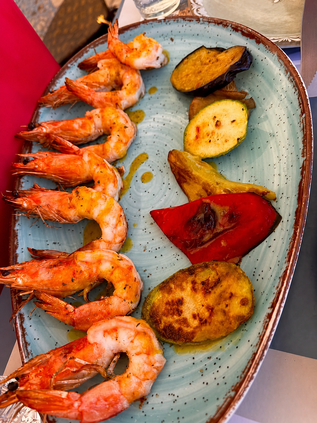 A platter of prawns, grilled vegetables and halloumi